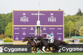 Maltese Cross (black cap) gets up to win the Grand Prix de Paris