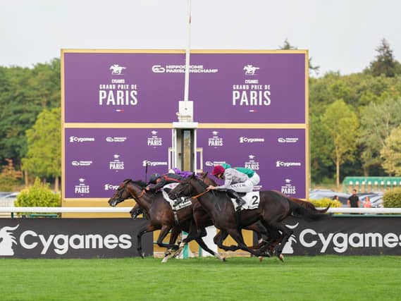 Maltese Cross (black cap) gets up to win the Grand Prix de Paris