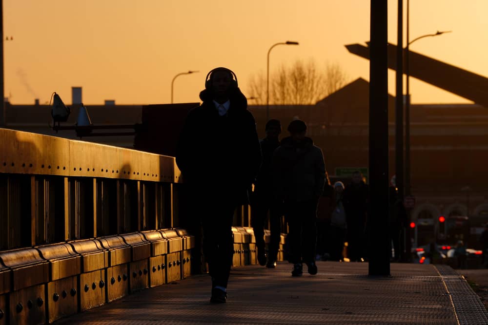 Commuters walk along Vauxhall Bridge, London