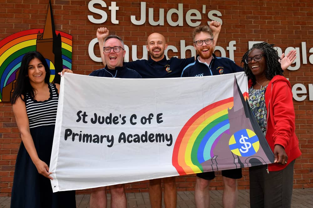 Headteacher James Williamson (centre) and senior leadership staff celebrate their Ofsted success at St Jude's CE Primary School, Wolverhampton.