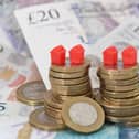Models of homes on coins