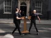 A lectern is moved into position outside 10 Downing Street on June 22 2026, the day Sir Keir Starmer announced his intention to resign as Labour leader and prime minister