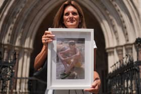 Ellen Roome holding a photo of her son Jools Sweeney outside the Royal Courts of Justice in London (Yui Mok/PA)