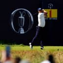 Bryson DeChambeau tees off in front of The Open logo