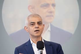 Head and shoulders photo of Sir Sadiq Khan speaking into a microphone