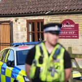 Police outside Johnsons of Old Hurst building