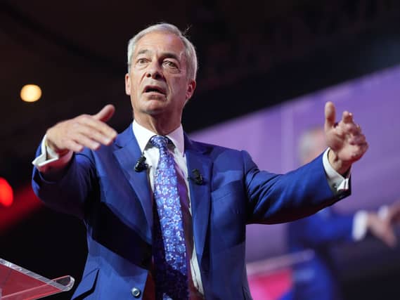 Nigel Farage gestures during a speech