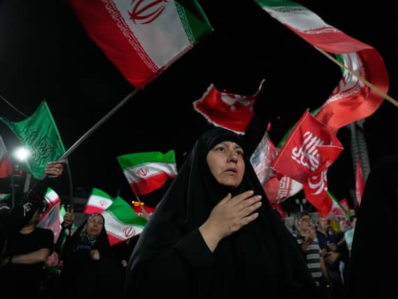 Pro-government demonstrators gather at a square in Tehran