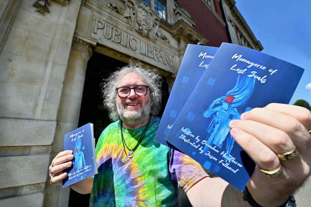 Brendan Hawthorne poses with his new book 'Menagerie of Lost Souls', which features a unique stable of characters presenting a tantalising view into tortured souls