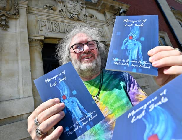 Brendan Hawthorne poses with his new book 'Menagerie of Lost Souls', which features a unique stable of characters presenting a tantalising view into tortured souls  