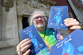 Brendan Hawthorne poses with his new book 'Menagerie of Lost Souls', which features a unique stable of characters presenting a tantalising view into tortured souls  