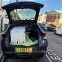 A fridge in the back of a car