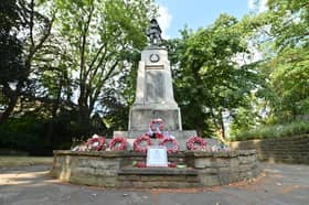 Darlaston War Memorial where a big metal plaque on the bottom of it has been stolen. The Memorial is looking very unloved and forgotten with old faded plastic poppy wreaths all around it.