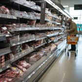 A person browses food in a supermarket