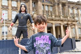 William Qureshi, eight, visits the giant inflatable Ozzy in Victoria Square on "Ozzy Day".