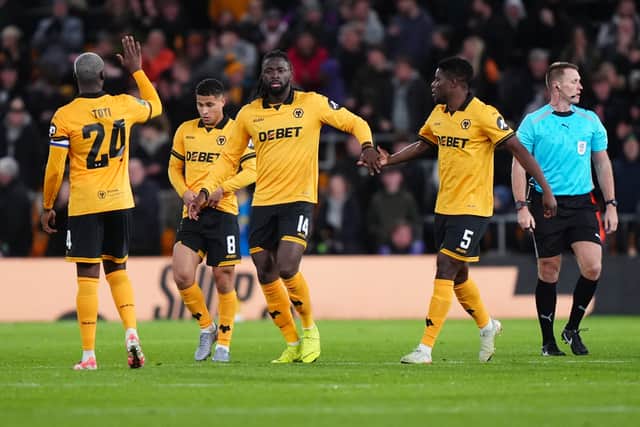 Tolu Arokodare, centre, celebrates after scoring for Wolves (Bradley Collyer/PA)