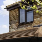 A modern home extension featuring double-glazed window installations and roofline improvements by Reliant Windows.