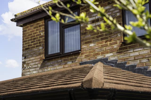 A modern home extension featuring double-glazed window installations and roofline improvements by Reliant Windows.