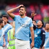 Manchester City midfielder Rodri gestures to supporters after a game