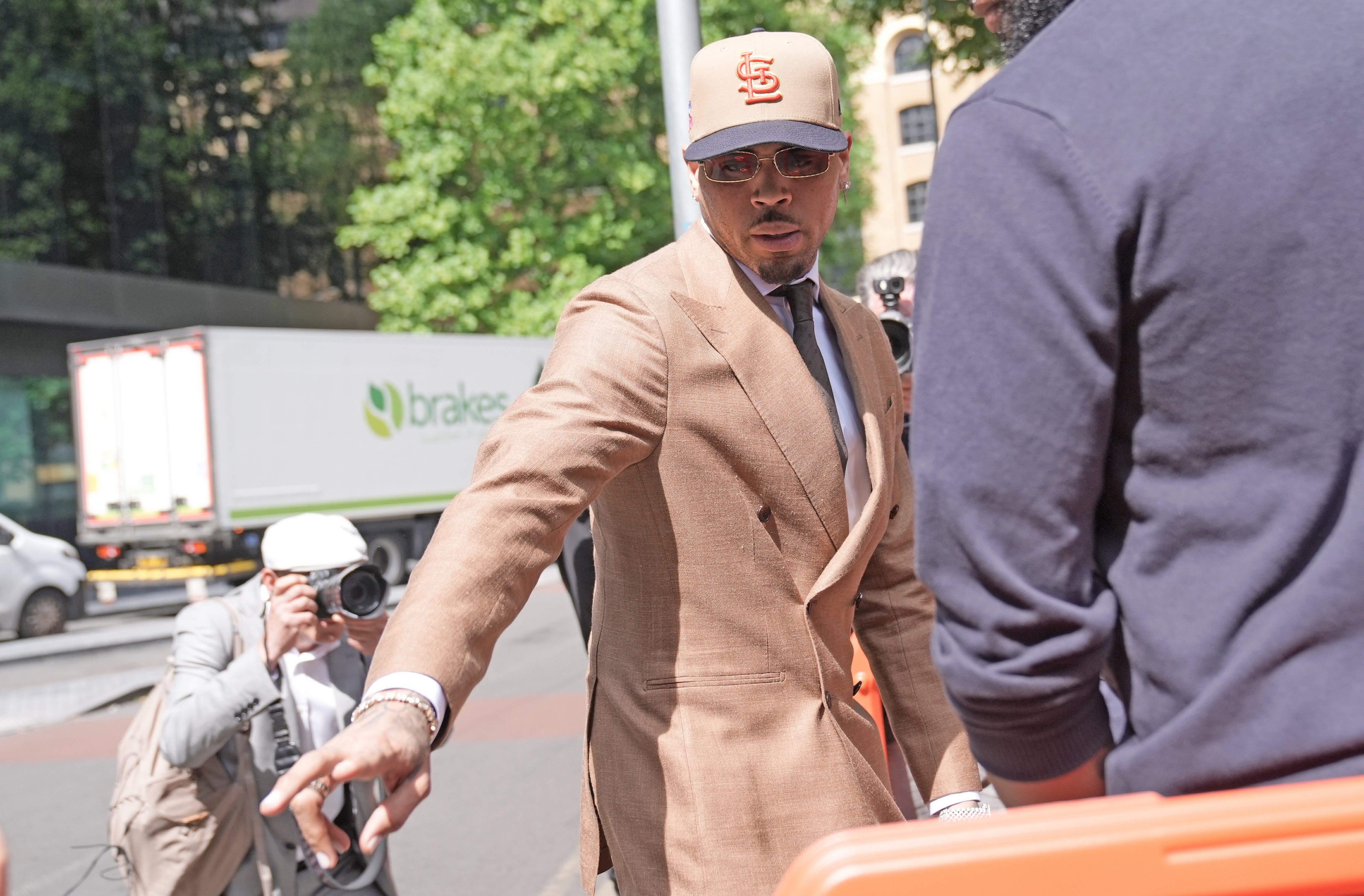 Singer Chris Brown pleads guilty to affray after bottle attack at ...