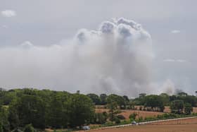 Smoke rises from a wildfire at Dunwich Heath, near Leiston, as major incident has been declared as firefighters battle a large heathland blaze