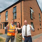 Gavin Ward - Morro Partnerships West Midlands operations director (left), and Councillor Steve Evans - Wolverhampton Council's deputy leader and cabinet member (right), with resident Lucy Whetton (centre) outside her new council home in Waveney Gardens, Penn