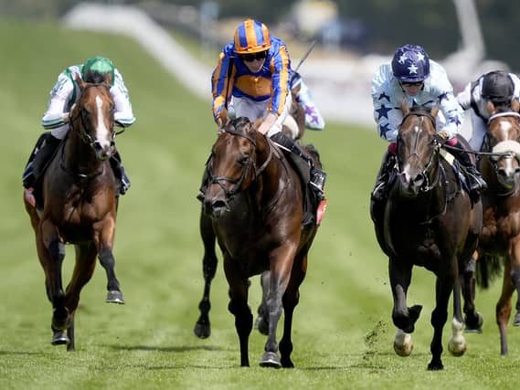 Man’s Best Friend (second left) got out late to win the Richmond Stakes