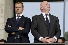UEFA president Aleksander Ceferin, left, and FIFA president Gianni Infantino in the stands during Euro 2024