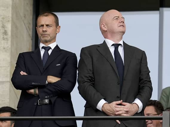 UEFA president Aleksander Ceferin, left, and FIFA president Gianni Infantino in the stands during Euro 2024