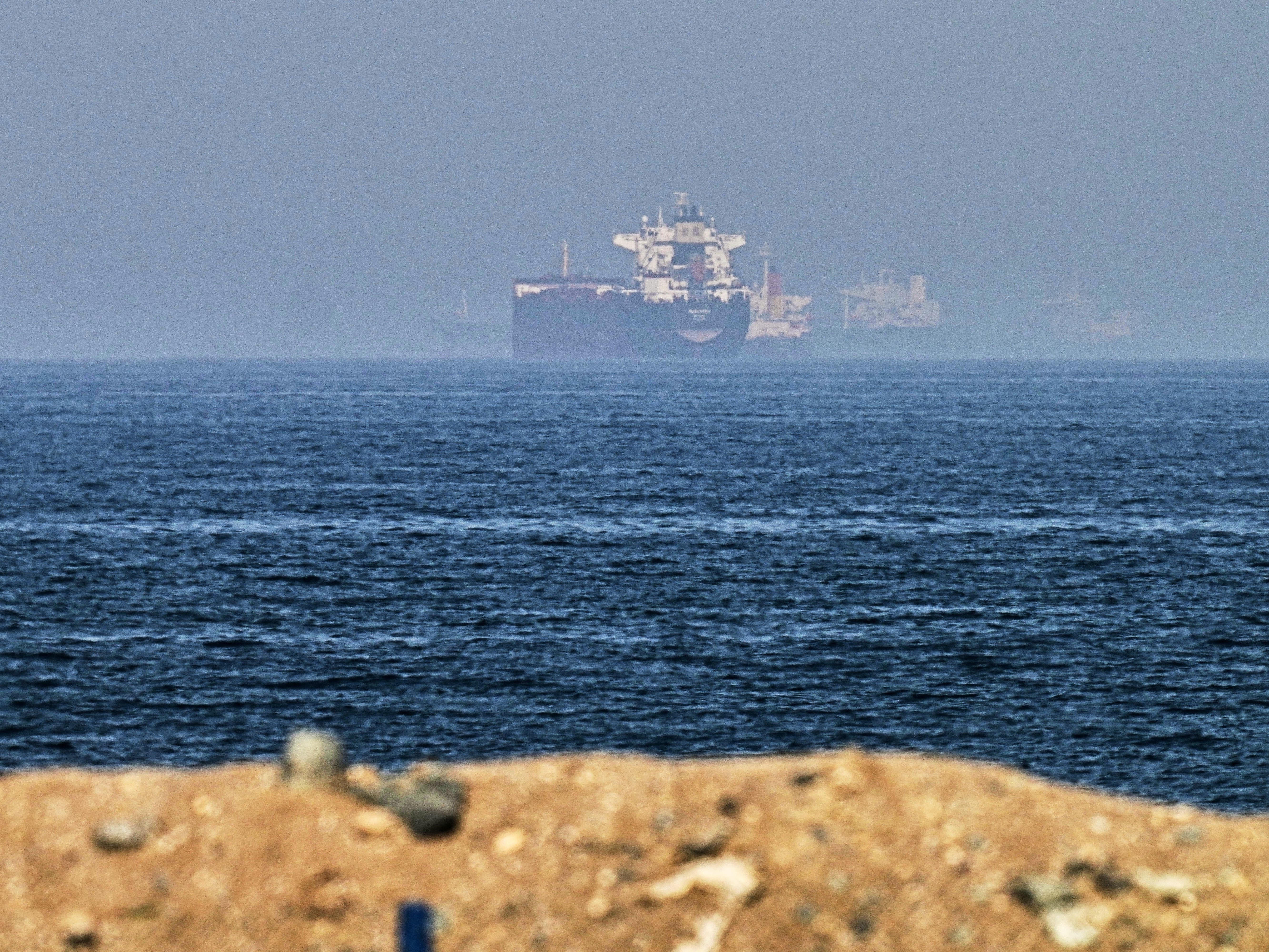 Cargo ship ‘hit by projectile’ as Iran and US argue over talks