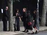 Bono arriving for the funeral of Glen Hansard