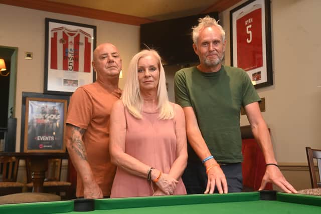 Ryan’s stepdad Phil Taylor, mom Gill Taylor and dad Adrian Passey at the Raven Pub, Brierley Hill, where they have a corner dedicated to Ryan 