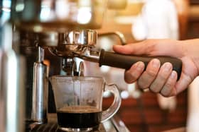 Coffee being prepared in a coffee shop