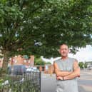 Local resident Ian Johnson standing next to the tree that has nappies on it.