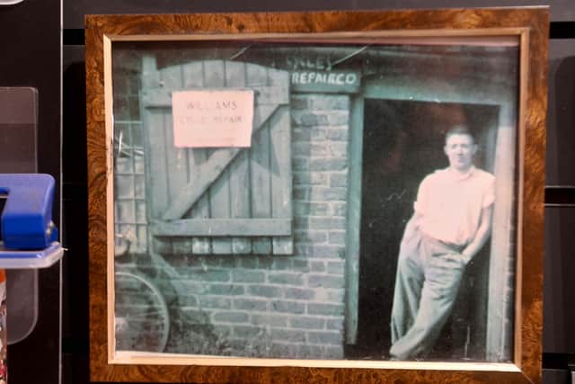 An old Express & Star press cutting showing Fred Williams with an earlier version of the shop