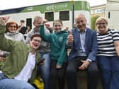 Taoiseach Micheál Martin (second from right) and others give a thumbs-up at Fleadh Cheoil na hÉireann 2026 in Belfast