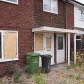 House with boarded windows