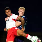 Stevenage’s Josh Magennis (left) and Wycombe’s Connor Taylor battle for the ball