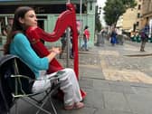 A musician performs in Belfast's Cathedral Quarter