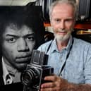 Gered Mankowitz with his photograph of Jimi Hendrix