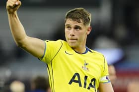 Micky van de Ven raises his right fist in celebration