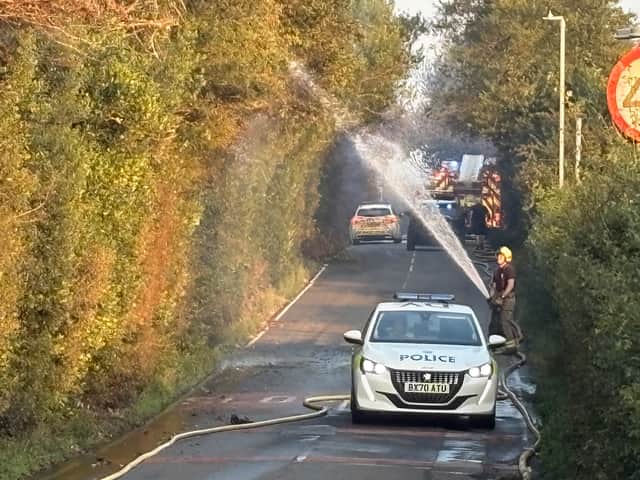 Fire crews working on Racecourse Lane, Stourbridge, near properties damaged by a major fire on August 13