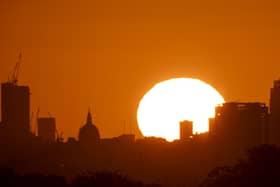 The sun rises over buildings in London