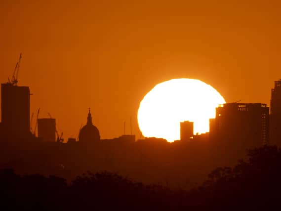 The sun rises over buildings in London