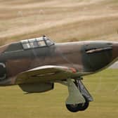 A Hawker Hurricane Mk XIIa 5711 (G-HURI) fighter aircraft prepares to perform an aerobatic display at the IWM Duxford on 18 October 2012 in Duxford, England.