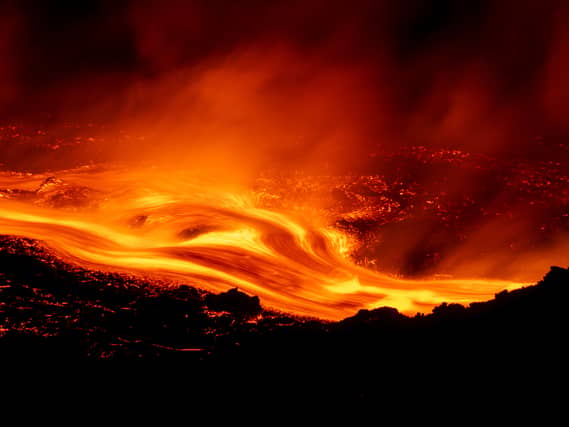 Eruptive activity continues on Mount Etna, where lava flows continue to descend on the slopes of the volcano, as seen from Serracozzo near Catania, Italy
