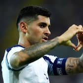 Cristian Romero makes a heart shape with his hands