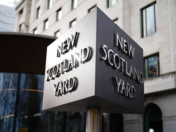 New Scotland Yard sign outside the Metropolitan Police headquarters in London