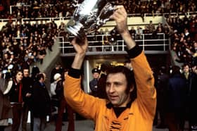 Victorious Wolverhampton Wanderers captain Mike Bailey holds the League Cup aloft in 1974