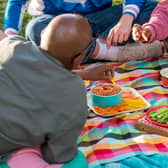 People eating finger foods at a picnic